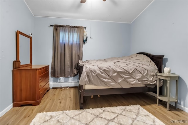 2035 Centerline Rd, Sheldon, NY 14167 - bedroom featuring crown molding, baseboard heating, wood finished floors, and ceiling fan