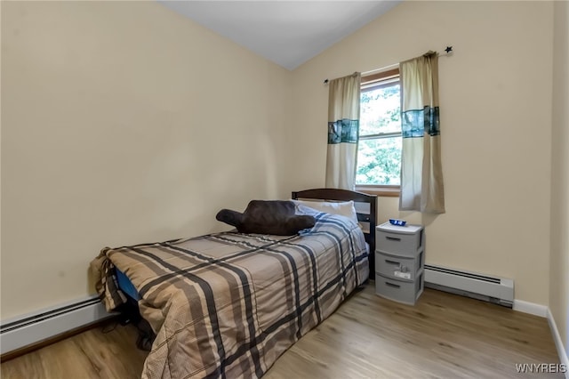 2035 Centerline Rd, Sheldon, NY 14167 - bedroom featuring baseboard heating, lofted ceiling, and light wood-type flooring
