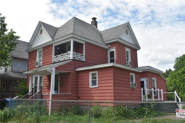 20 E Main St, Cortland, NY 13045 - view of side of home with a fenced front yard, a chimney, and cooling unit