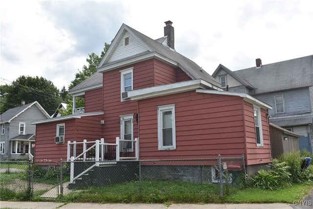 20 E Main St, Cortland, NY 13045 - rear view of house with a gate and a chimney