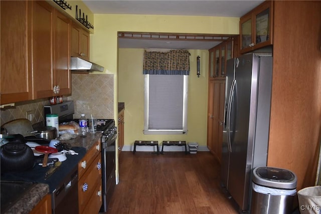 20 E Main St, Cortland, NY 13045 - kitchen featuring stainless steel appliances, exhaust hood, brown cabinets, dark wood-style floors, and glass insert cabinets