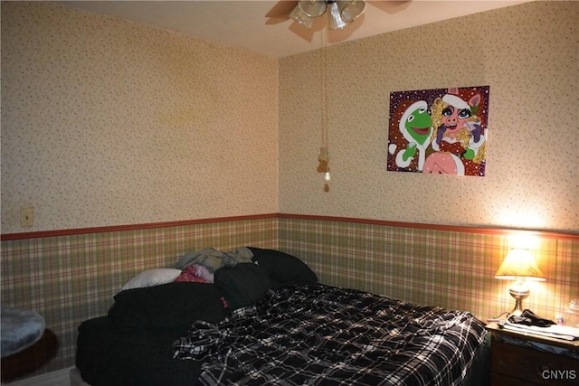 20 E Main St, Cortland, NY 13045 - bedroom featuring wallpapered walls, a wainscoted wall, and ceiling fan