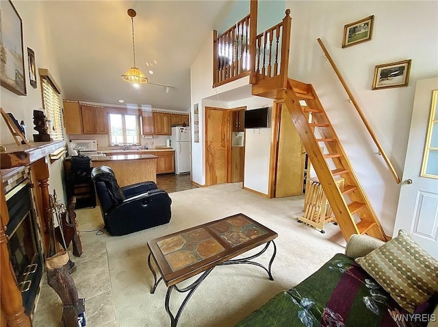 5436 Java Lake Rd, Java, NY 14009 - living room featuring stairway, high vaulted ceiling, light colored carpet, and a fireplace