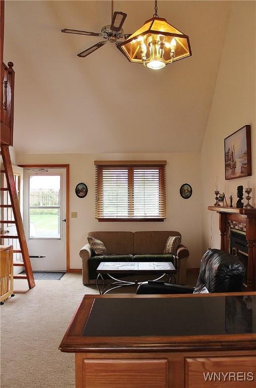 5436 Java Lake Rd, Java, NY 14009 - carpeted living area featuring lofted ceiling, a fireplace, and ceiling fan