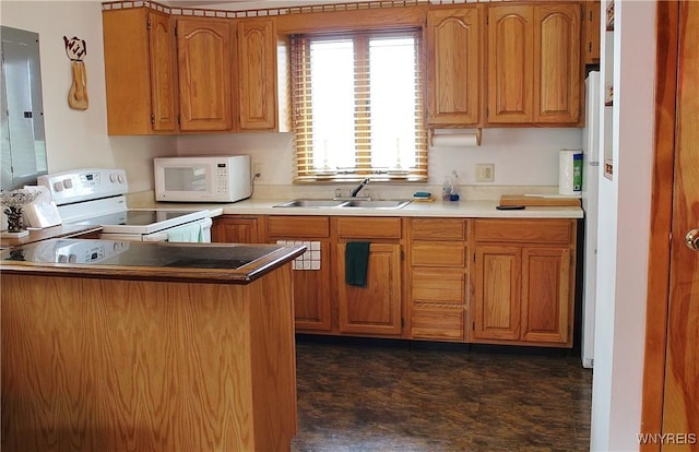 5436 Java Lake Rd, Java, NY 14009 - kitchen with white appliances, electric panel, brown cabinetry, a peninsula, and light countertops