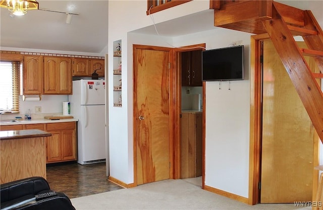 5436 Java Lake Rd, Java, NY 14009 - kitchen featuring freestanding refrigerator, track lighting, light countertops, lofted ceiling, and brown cabinetry