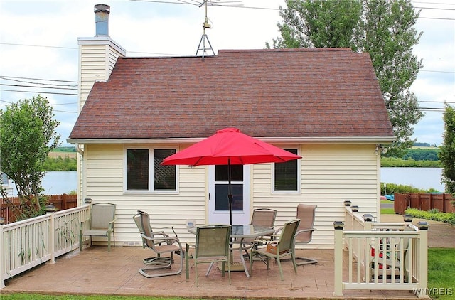5436 Java Lake Rd, Java, NY 14009 - back of property featuring a chimney, a shingled roof, and a deck with water view