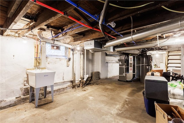 72 Weld St, Rochester, NY 14605 - below grade area featuring heating unit and a sink