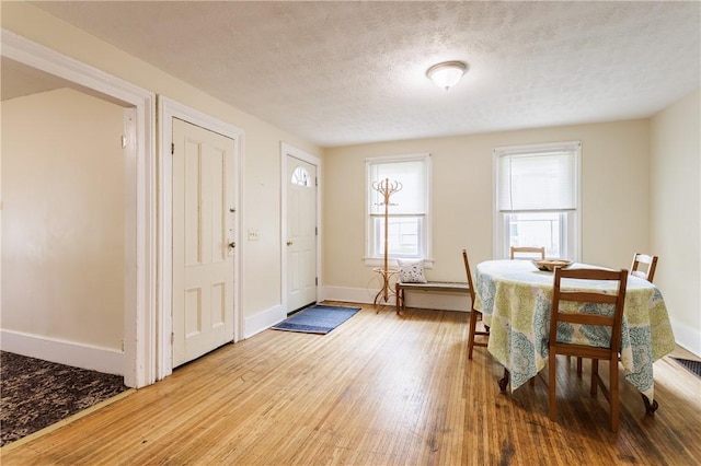 72 Weld St, Rochester, NY 14605 - dining space featuring wood finished floors and a textured ceiling