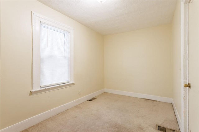 72 Weld St, Rochester, NY 14605 - unfurnished room with light colored carpet and a textured ceiling