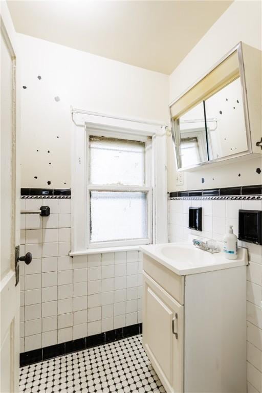 72 Weld St, Rochester, NY 14605 - bathroom featuring tile walls and vanity