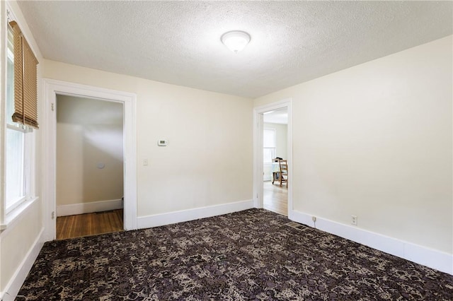 72 Weld St, Rochester, NY 14605 - carpeted spare room featuring a textured ceiling and baseboards