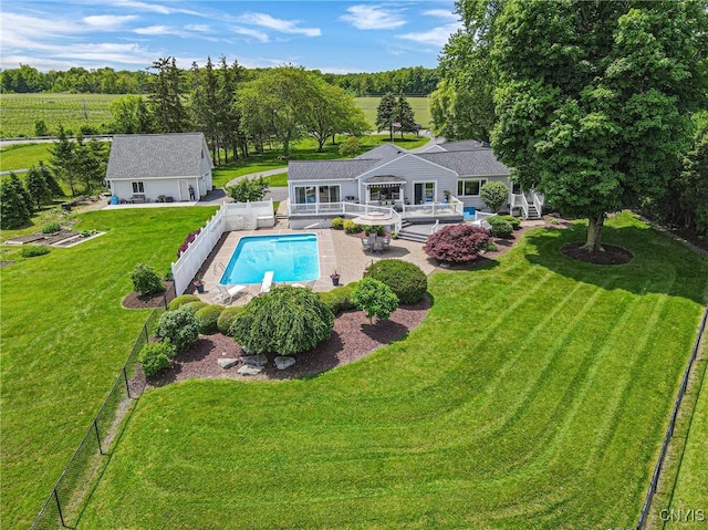 2516 W Lake Rd, Skaneateles, NY 13152 - rear view of house featuring a fenced backyard, a patio, and an outbuilding