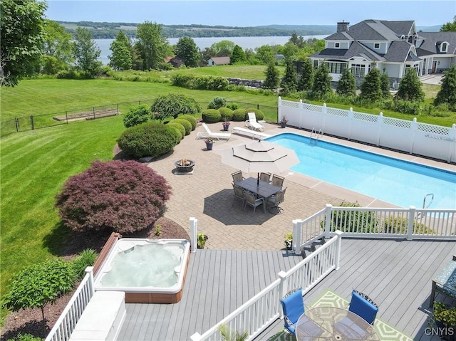2516 W Lake Rd, Skaneateles, NY 13152 - view of swimming pool with a hot tub, a deck with water view, outdoor dining area, a patio, and an outdoor fire pit