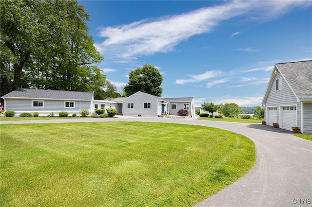 2516 W Lake Rd, Skaneateles, NY 13152 - ranch-style home with a front lawn, driveway, and a shingled roof