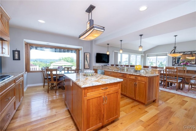 2516 W Lake Rd, Skaneateles, NY 13152 - kitchen with a center island, light wood-style flooring, dishwasher, brown cabinetry, and lofted ceiling