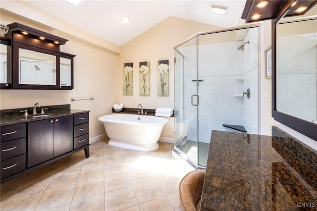 2516 W Lake Rd, Skaneateles, NY 13152 - bathroom featuring vaulted ceiling, vanity, a shower stall, a freestanding bath, and tile patterned flooring