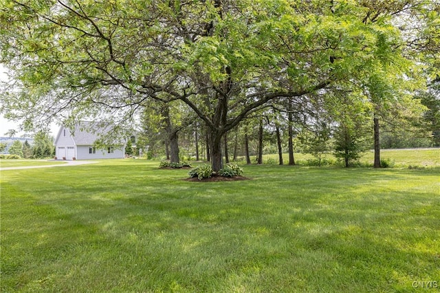 2516 W Lake Rd, Skaneateles, NY 13152 - view of green lawn with an attached garage