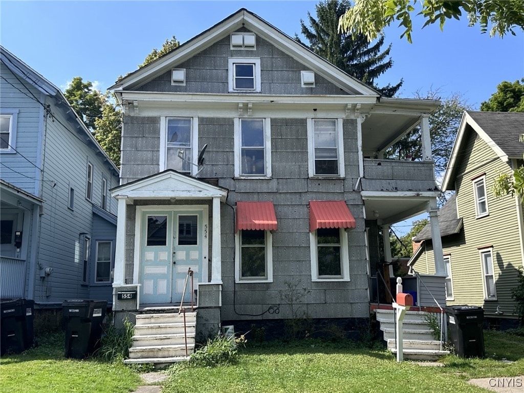 552-54 Columbus Ave, Syracuse, NY 13210 - view of front facade featuring a front lawn and entry steps