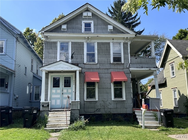 552-54 Columbus Ave, Syracuse, NY 13210 - view of front facade featuring a front lawn and entry steps