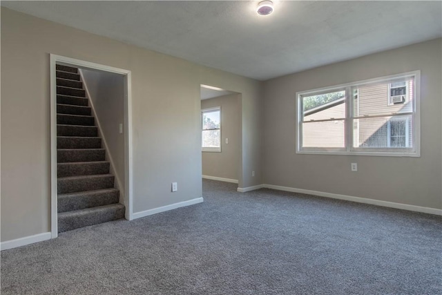 11 Grove St, Adams, NY 13605 - empty room with carpet flooring, plenty of natural light, and stairs