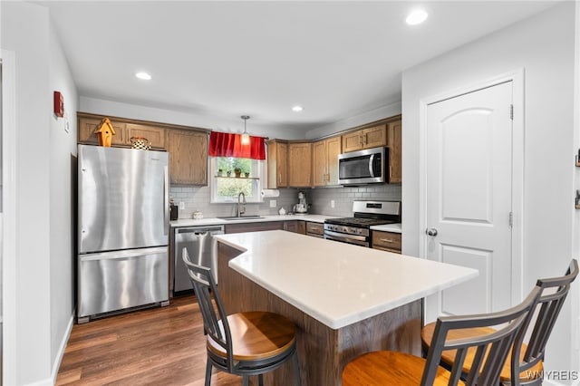 720 N Star Rd, Elma, NY 14052 - kitchen featuring stainless steel appliances, dark wood finished floors, decorative backsplash, light countertops, and recessed lighting