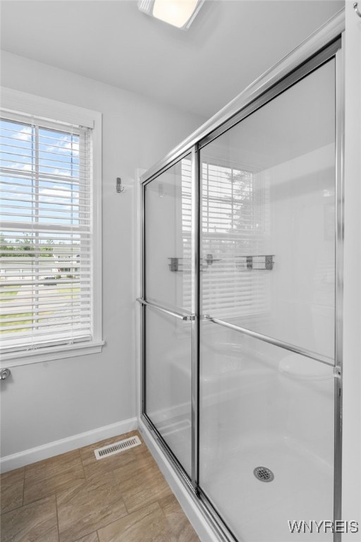 720 N Star Rd, Elma, NY 14052 - full bathroom featuring baseboards and a stall shower