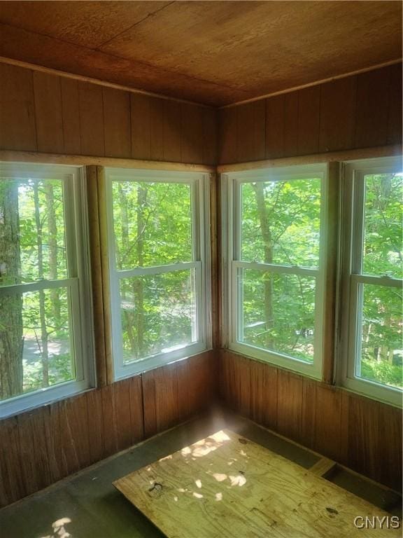 182 Seneca Rd, Webb, NY 13420 - unfurnished sunroom featuring wooden ceiling, healthy amount of natural light, and wood walls