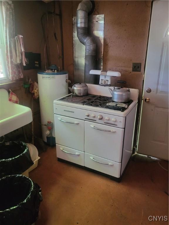 182 Seneca Rd, Webb, NY 13420 - kitchen featuring gas water heater, white gas range, and white cabinets
