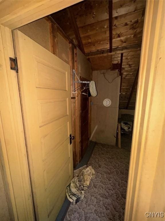 182 Seneca Rd, Webb, NY 13420 - hallway featuring lofted ceiling and carpet flooring