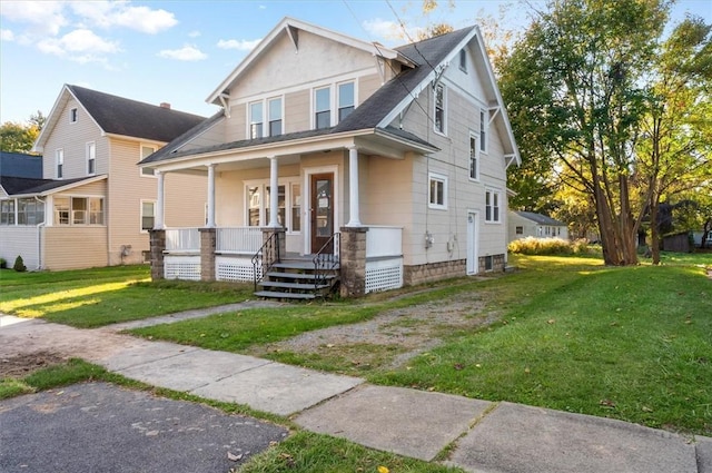 23 Peacock St, Auburn, NY 13021 - view of front of home featuring covered porch and a front yard