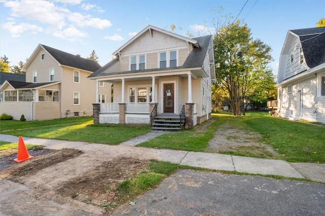 23 Peacock St, Auburn, NY 13021 - view of front of home featuring a porch and a front yard