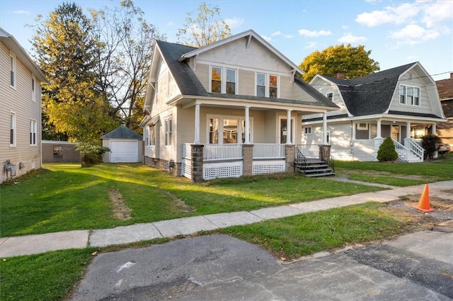 23 Peacock St, Auburn, NY 13021 - view of front of home with a porch, a detached garage, a front yard, and an outdoor structure