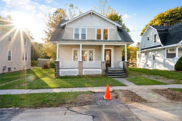 23 Peacock St, Auburn, NY 13021 - view of front of home with a porch and a front lawn