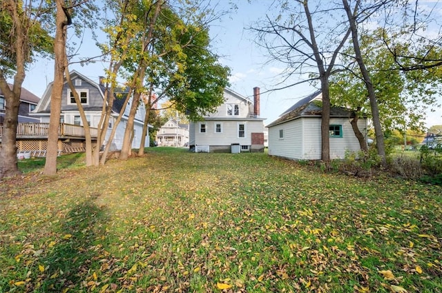 23 Peacock St, Auburn, NY 13021 - view of grassy yard featuring a deck