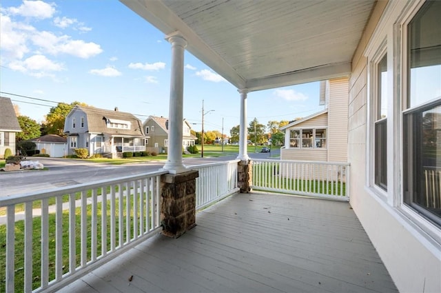 23 Peacock St, Auburn, NY 13021 - wooden porch featuring a residential view
