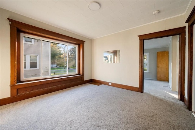 23 Peacock St, Auburn, NY 13021 - carpeted empty room with a smoke detector and crown molding