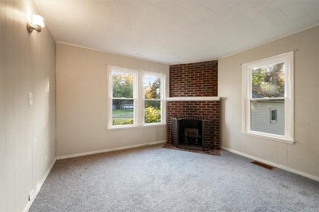 23 Peacock St, Auburn, NY 13021 - unfurnished living room with carpet, plenty of natural light, a brick fireplace, and crown molding