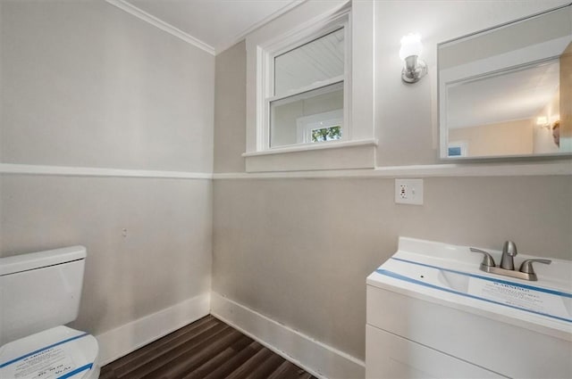 23 Peacock St, Auburn, NY 13021 - bathroom with wood finished floors, vanity, and ornamental molding