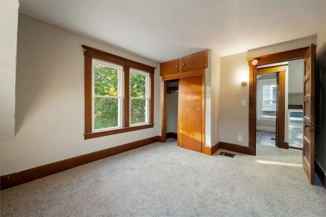 23 Peacock St, Auburn, NY 13021 - unfurnished bedroom with carpet and a closet