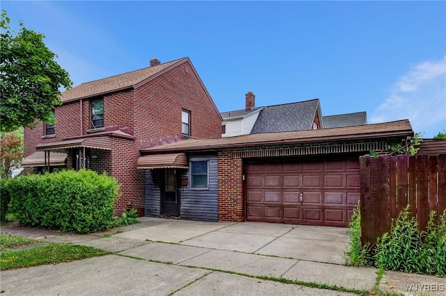 2104 Walnut Ave, Niagara Falls, NY 14301 - view of front facade featuring an attached garage, brick siding, and concrete driveway