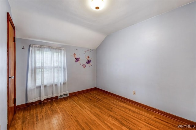 2104 Walnut Ave, Niagara Falls, NY 14301 - unfurnished room with wood-type flooring and vaulted ceiling