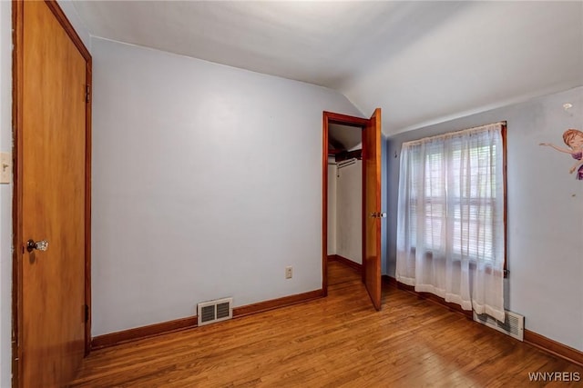 2104 Walnut Ave, Niagara Falls, NY 14301 - unfurnished bedroom with light wood-style floors and vaulted ceiling