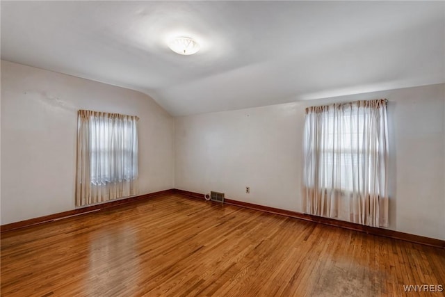 2104 Walnut Ave, Niagara Falls, NY 14301 - spare room featuring lofted ceiling and light wood-type flooring