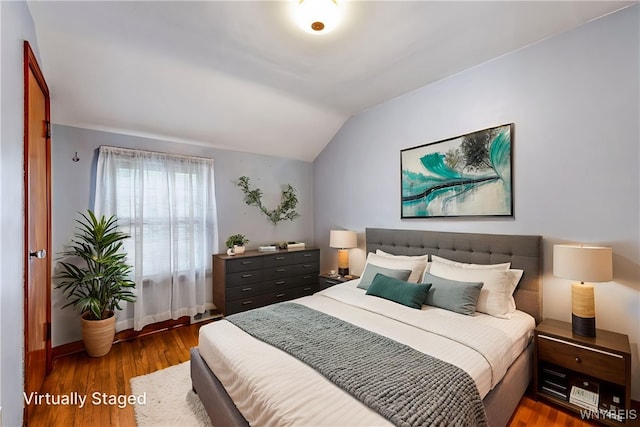 2104 Walnut Ave, Niagara Falls, NY 14301 - bedroom featuring lofted ceiling and wood finished floors