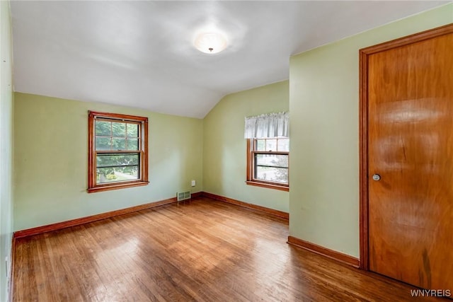 2104 Walnut Ave, Niagara Falls, NY 14301 - empty room with lofted ceiling and wood finished floors