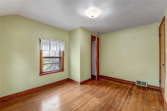 2104 Walnut Ave, Niagara Falls, NY 14301 - unfurnished room featuring wood finished floors and vaulted ceiling
