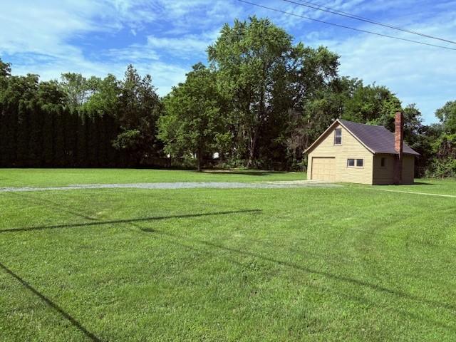 19 California Ave, Horseheads, NY 14903 - view of green lawn featuring an outbuilding and a garage