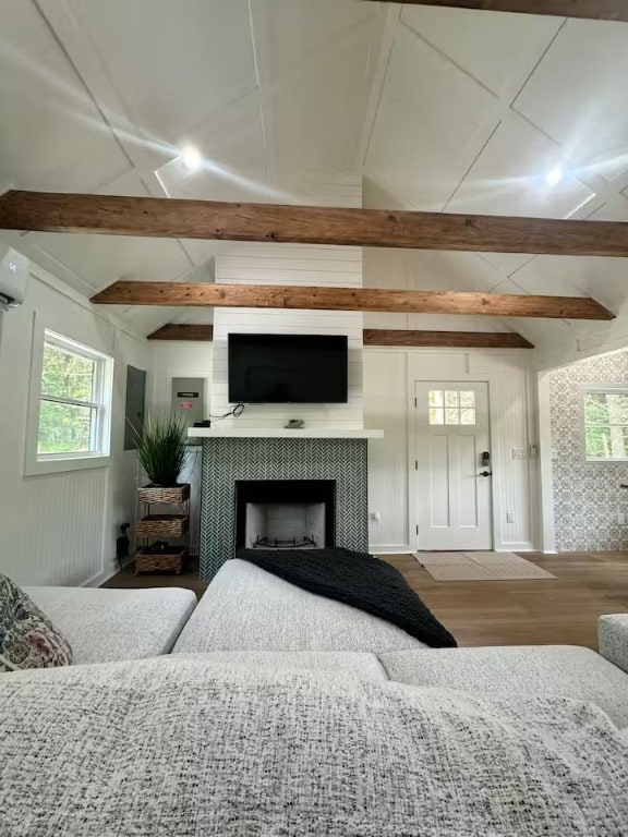 1737 Tupper Hill Rd, Franklin, NY 13775 - living room with wood finished floors, healthy amount of natural light, a tile fireplace, and a wall mounted AC