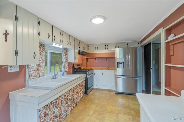 388 Sutton Rd, Schroeppel, NY 13132 - kitchen featuring appliances with stainless steel finishes, under cabinet range hood, light countertops, and ornamental molding